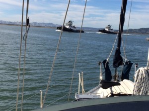 Two tugs getting ready to push one of the oil tankers